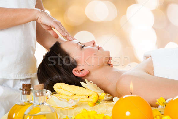 Woman Receiving Head Massage From Massager Stock photo © AndreyPopov