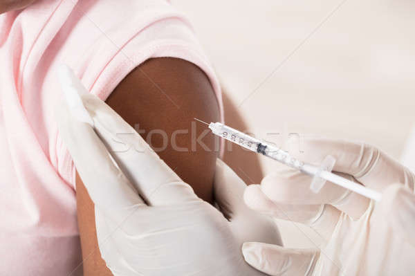 Close-up Of Doctor's Hand Applying Injection To Patient's Hand Stock photo © AndreyPopov