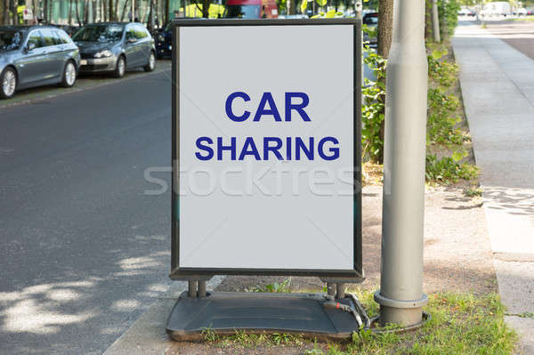 Car sharing sign on board by street Stock photo © AndreyPopov