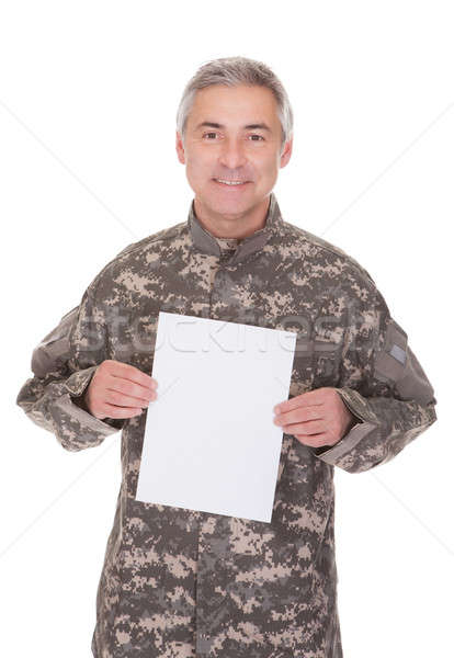 Reifen Soldat halten leeres Papier isoliert weiß Stock foto © AndreyPopov