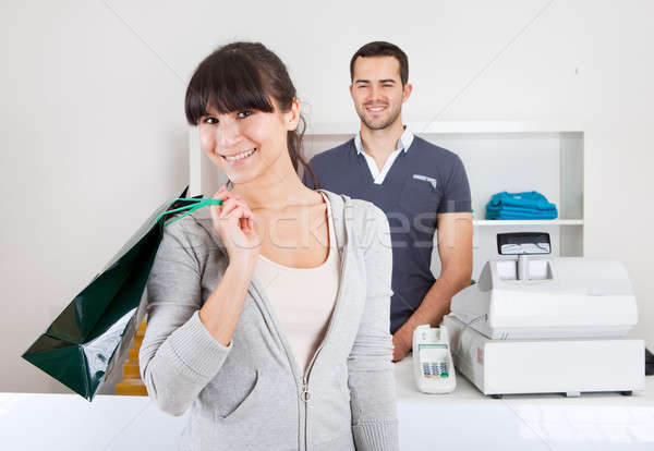 Stock photo: Customer buying clothes in shop