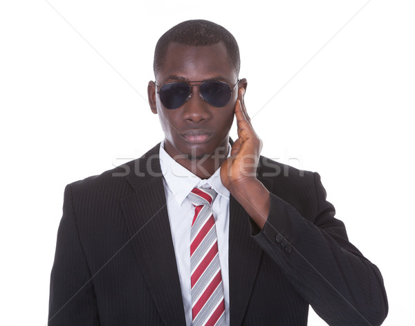African Young Man With Hand On Ear Stock photo © AndreyPopov