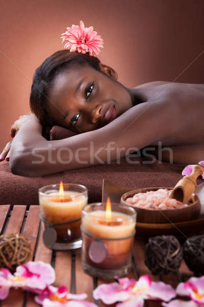 Souriant jeune femme détente salon de beauté vue de côté portrait [[stock_photo]] © AndreyPopov