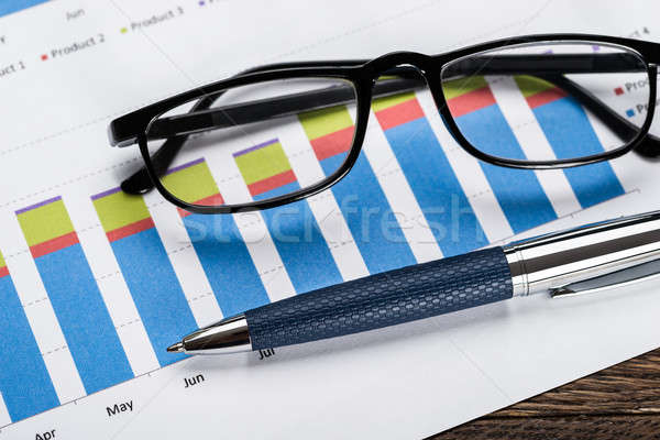 Financial Graph With Eyeglasses And Pen Stock photo © AndreyPopov