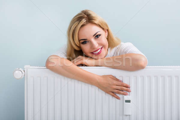 Nő pulóver dől radiátor fiatal boldog Stock fotó © AndreyPopov