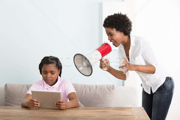 Mother Shouts At Her Daughter In A Megaphone Stock photo © AndreyPopov