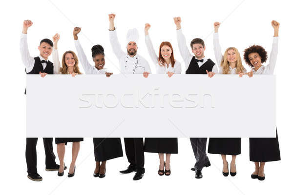 Multiracial Restaurant Staff Holding Billboard Stock photo © AndreyPopov