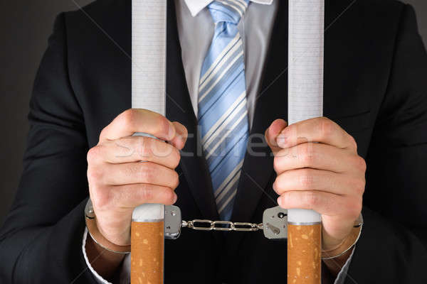 Сток-фото: бизнесмен · большой · сигареты · наручники
