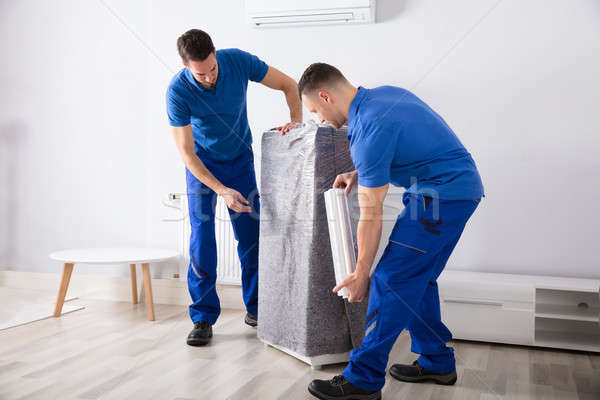 Two Male Movers Packing Furniture Stock photo © AndreyPopov