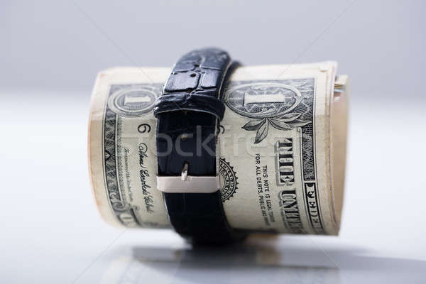 Rolled Up Dollar Banknotes Tied With Belt Stock photo © AndreyPopov