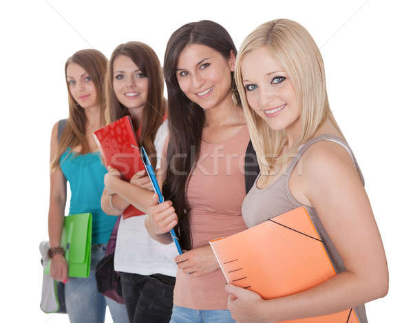 Four female students in a row Stock photo © AndreyPopov