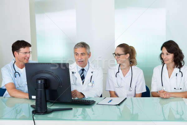Doctors having a meeting Stock photo © AndreyPopov