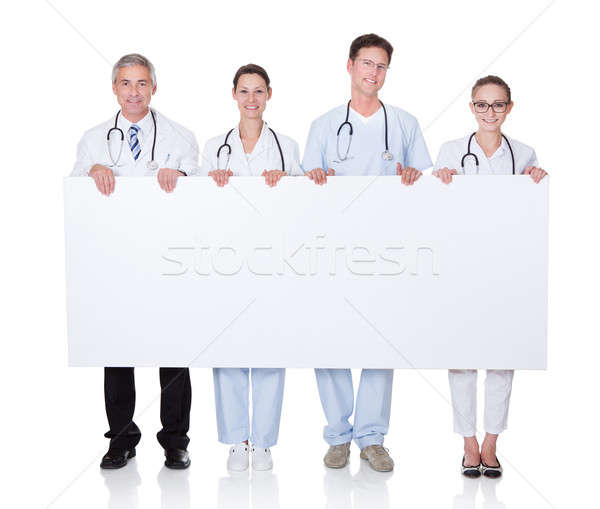 медицинской сотрудников белый баннер четыре Сток-фото © AndreyPopov