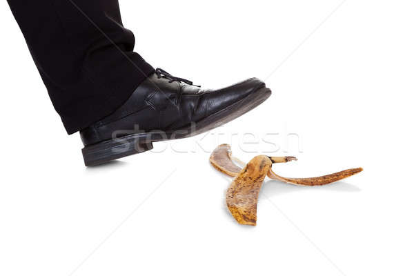 Businessman slipping on banana peel Stock photo © AndreyPopov