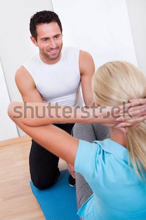 Fitness instructor and woman Stock photo © AndreyPopov