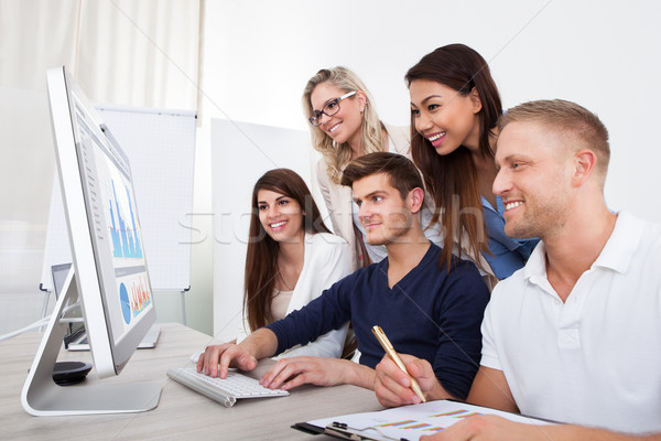 Smiling Businesspeople Using Desktop PC Stock photo © AndreyPopov