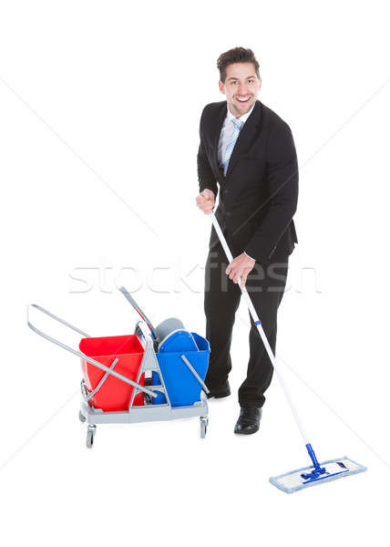 Businessman Mopping Over White Background Stock photo © AndreyPopov