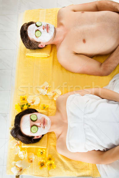 Couple With Face Mask Relaxing In Beauty Spa Stock photo © AndreyPopov