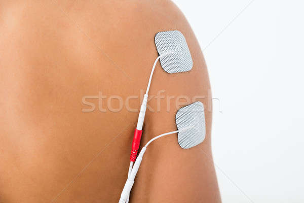 Person With Electrodes On Shoulder Stock photo © AndreyPopov