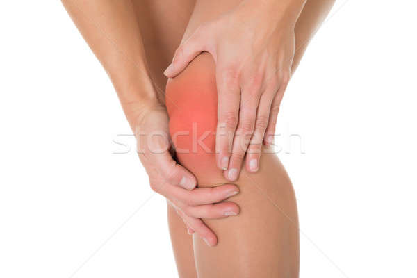 Afbeelding vrouw lijden knie pijn witte Stockfoto © AndreyPopov