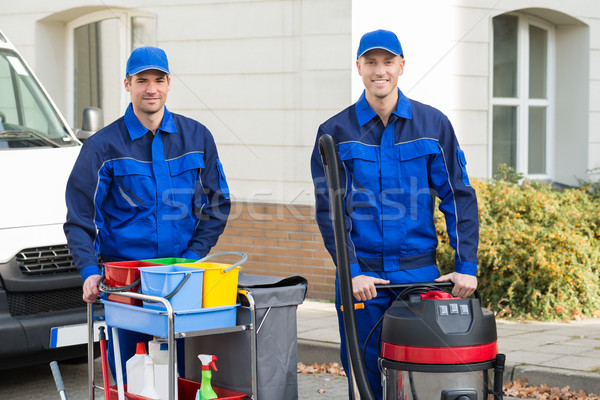 Happy Janitors Standing Against Truck Stock photo © AndreyPopov