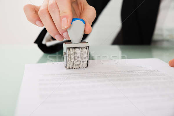 Businesswoman Hand Stamping Paper With Date Stamper Stock photo © AndreyPopov