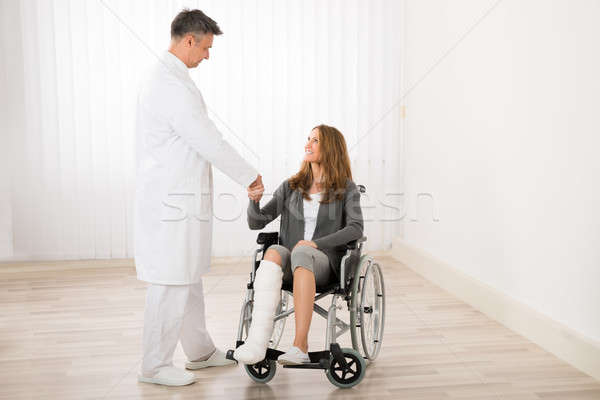 Stock photo: Doctor Shaking Hands With Patient