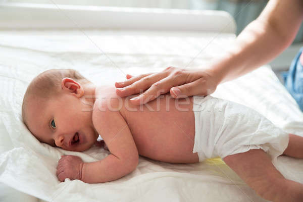 Mother Patting On Baby's Back Stock photo © AndreyPopov
