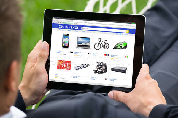 Businessman Doing Online Shopping On Digital Tablet Stock photo © AndreyPopov