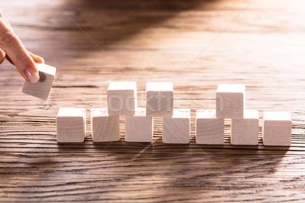 Person Hand Arranging Blocks Stock photo © AndreyPopov