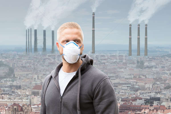 Férfi visel szennyezés maszk füst gyár Stock fotó © AndreyPopov