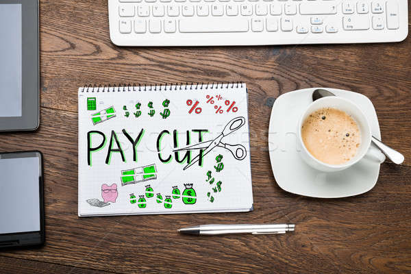 Salary Paycut In Notepad Stock photo © AndreyPopov