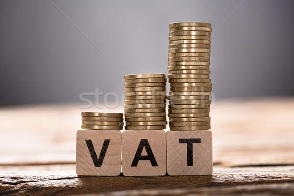 Vat Text Written On Wooden Blocks With Stacked Coins Stock photo © AndreyPopov