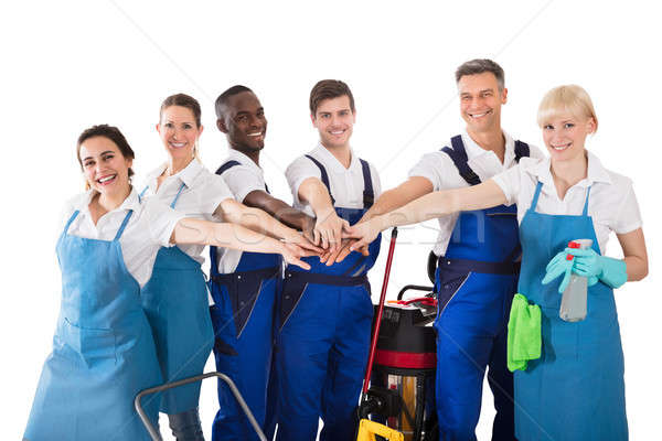 Group Of Happy Janitors Stacking Hands Stock photo © AndreyPopov