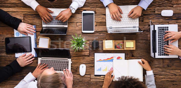 Stock photo: Group Of Businesspeople Working On Laptop