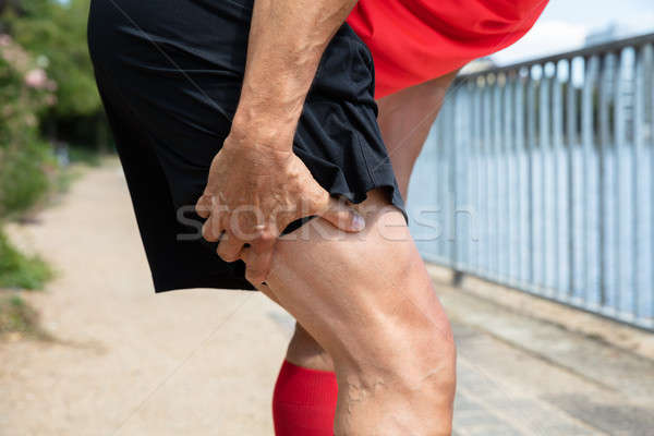 Runner Holding His Injured Leg Stock photo © AndreyPopov