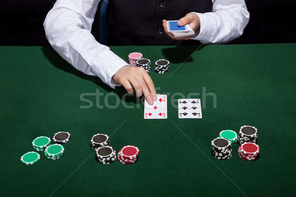 Croupier dealing cards Stock photo © AndreyPopov