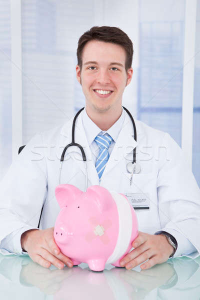 Orvos tart persely bandázs klinika portré Stock fotó © AndreyPopov