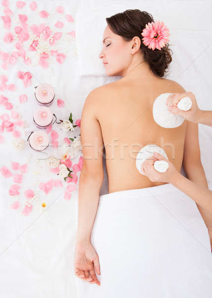 Woman Getting Herbal Compress Ball Therapy Stock photo © AndreyPopov
