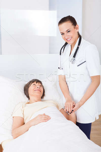 Female Doctor Consoling Senior Woman Stock photo © AndreyPopov