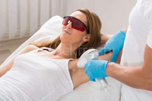 Woman Receiving Underarm Laser Hair Removal Stock photo © AndreyPopov