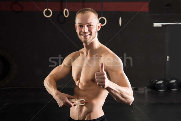 Person Measuring His Body Fat With Caliper Stock photo © AndreyPopov