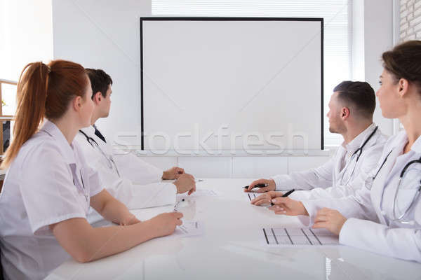 Doctors Looking At White Board Stock photo © AndreyPopov