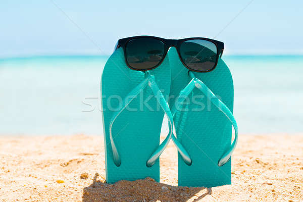 Sunglasses Over The Turquoise Flip Flop Stock photo © AndreyPopov