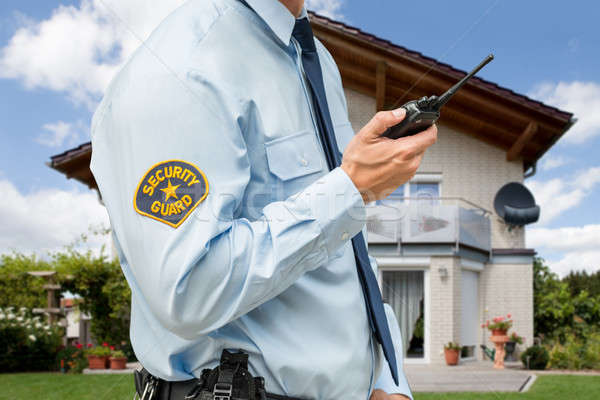 Security Guard Holding Walkie Talkie Stock photo © AndreyPopov