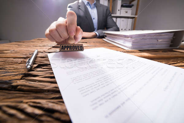 Close-up Of A Businessperson Approving Document Stock photo © AndreyPopov