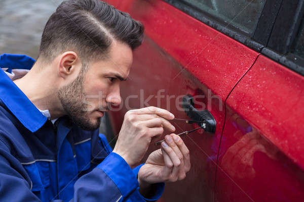Man Opening Car Door With Lockpicker Stock photo © AndreyPopov