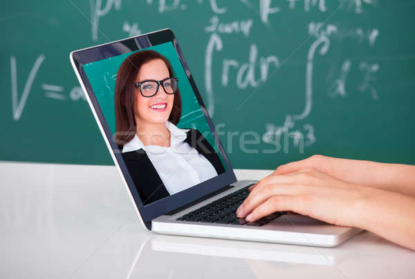 Student Attending Online Lecture On Laptop In Classroom Stock photo © AndreyPopov