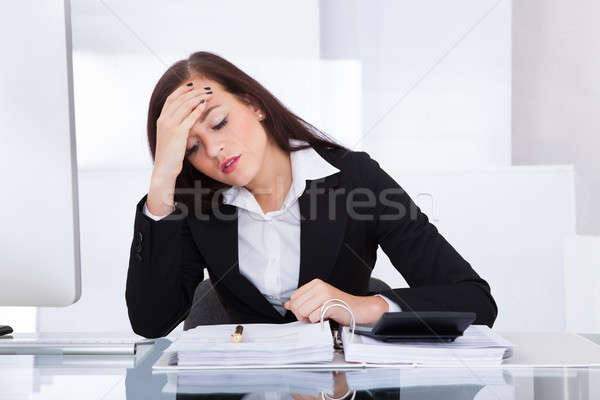 Tensed Businesswoman Calculating Tax Stock photo © AndreyPopov