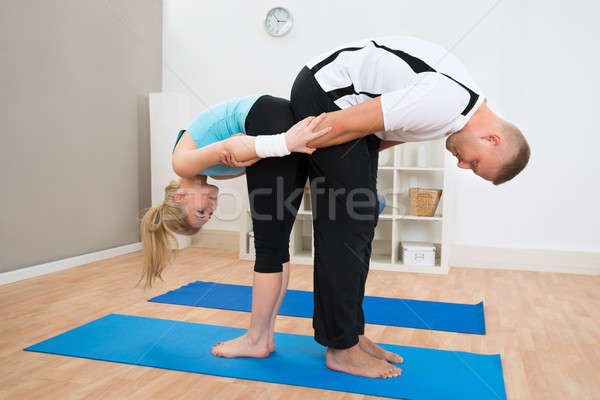 Couple Together Exercising On Mat Stock photo © AndreyPopov